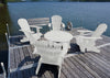 white adirondack chairs and coffee table